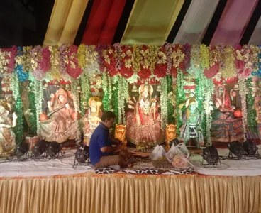 Darbar with floral canopy and Mata Rani idols