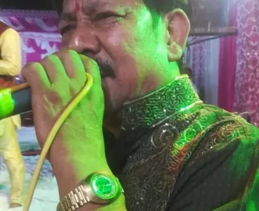 Singer with microphone performing at a devotional night