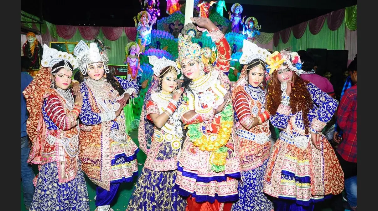 Jhankiya artists in colourful traditional costumes performing at a devotional event